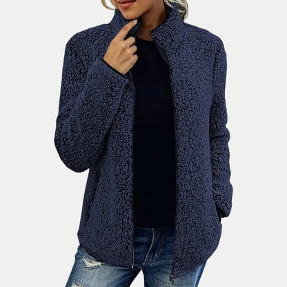 Damen-Teddyfleecejacke mit Stehkragen, durchgehendem Reißverschluss und Seitentaschen in Navyblau