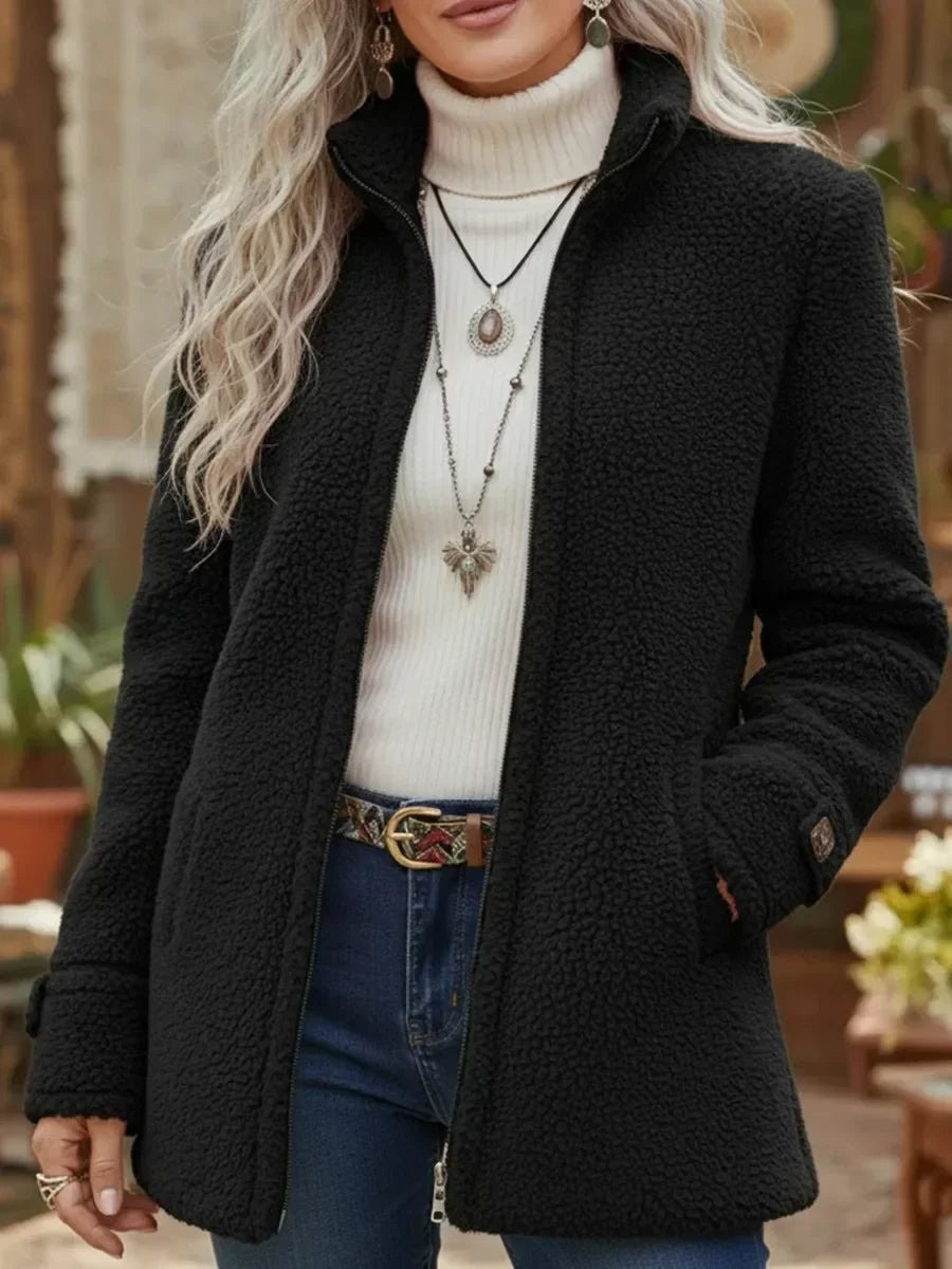 Damen-Teddyjacke mit Stehkragen, durchgehendem Reißverschluss und Seitentaschen in Schwarz