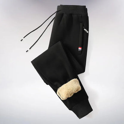Gefütterte Jogginghose für Herren mit Teddyfleece-Innenfutter, Kordelzug und Reißverschlusstaschen in Schwarz 2