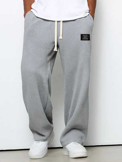 Herren-Hose mit Waffelstruktur, Kordelzug und geradem weitem Bein für Freizeit und Alltag in Grau