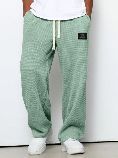 Herren-Hose mit Waffelstruktur, Kordelzug und geradem weitem Bein für Freizeit und Alltag in Grün