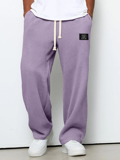 Herren-Hose mit Waffelstruktur, Kordelzug und geradem weitem Bein für Freizeit und Alltag in Lila