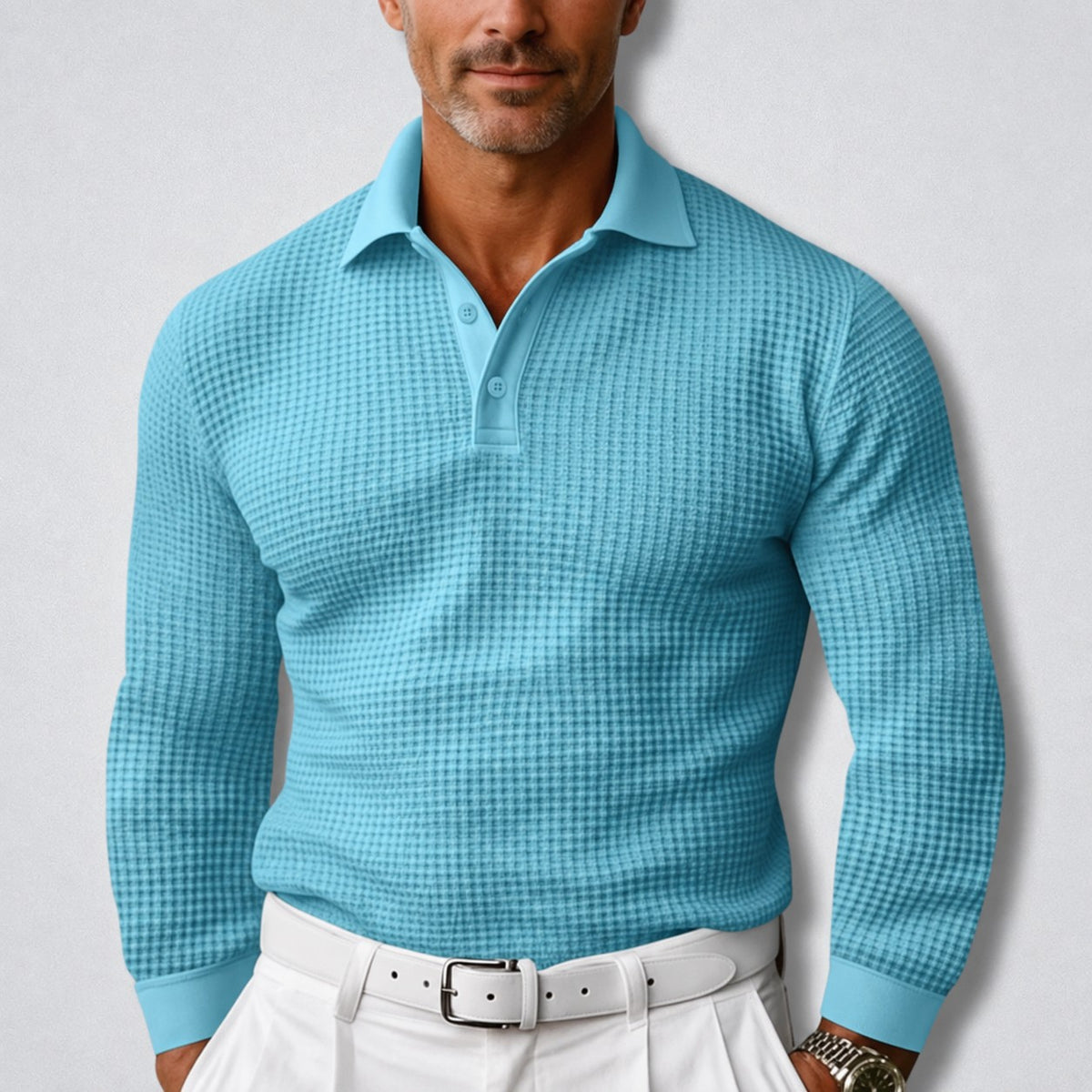 Herren-Polopullover in Waffelstruktur mit Polokragen, Knopfleiste und langen Ärmeln in Blau