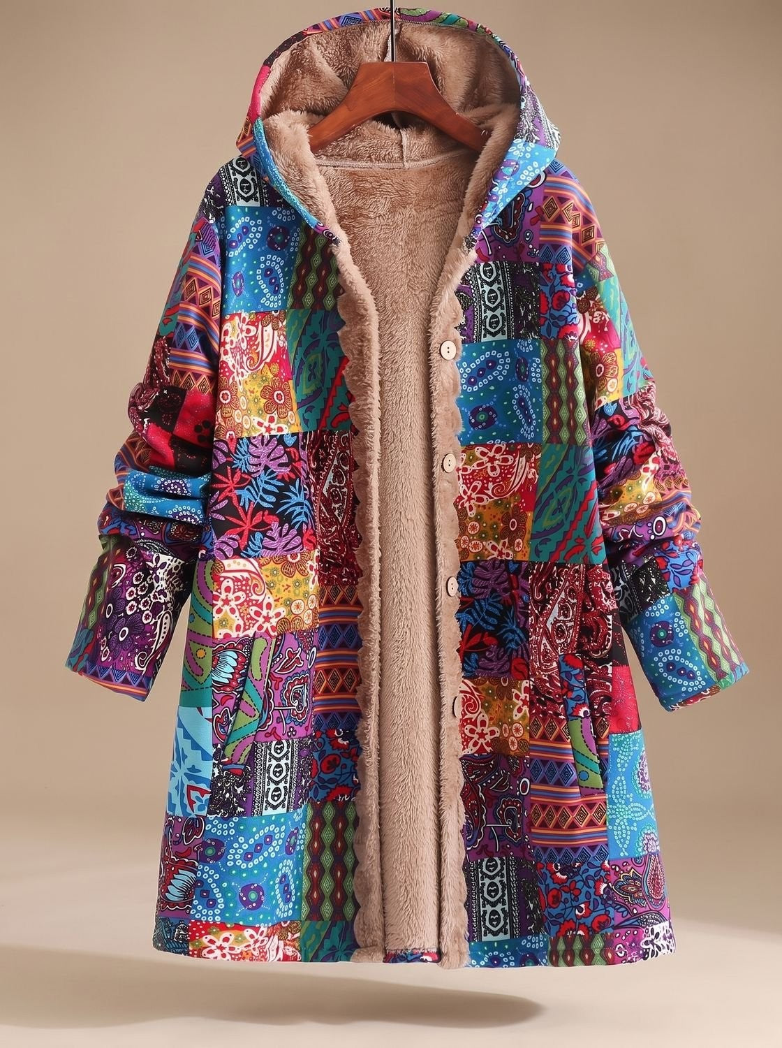 Lange Damen-Jacke im Patchwork-Design mit Fleecefutter, Kapuze und Knopfleiste in Blau