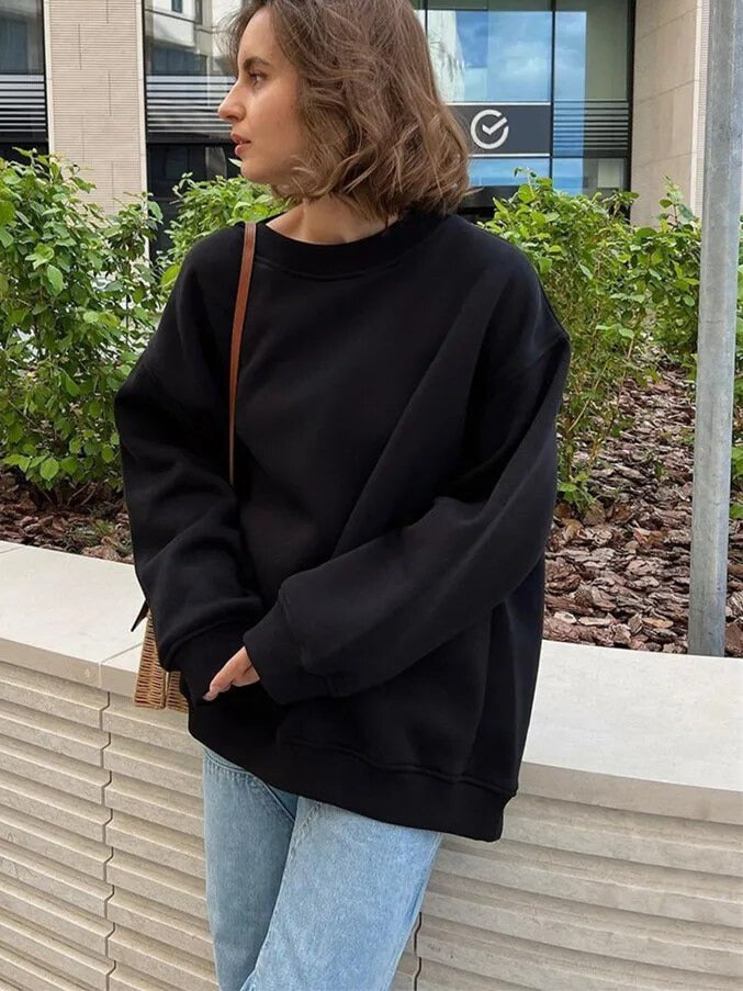 Oversized Damen-Sweatshirt mit Rundhals, überschnittenen Schultern und Rippbündchen in Schwarz