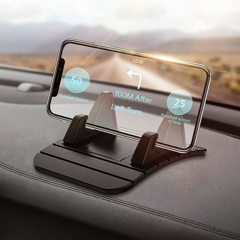 Smartphone in schwarzer Silikon-Handyhalterung auf dem Armaturenbrett