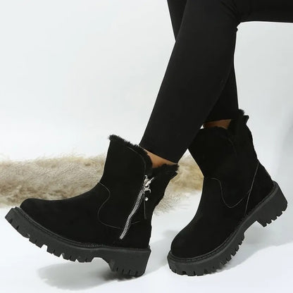 Warme Damen-Winterstiefeletten in Veloursoptik mit Kunstfellrand, Seitenreißverschluss und Profilsohle in Schwarz